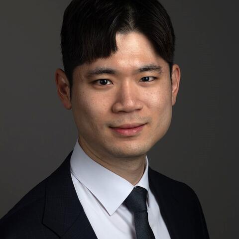 Photo of Dr. Hyeok-Hee Lee wearing a suit and tie