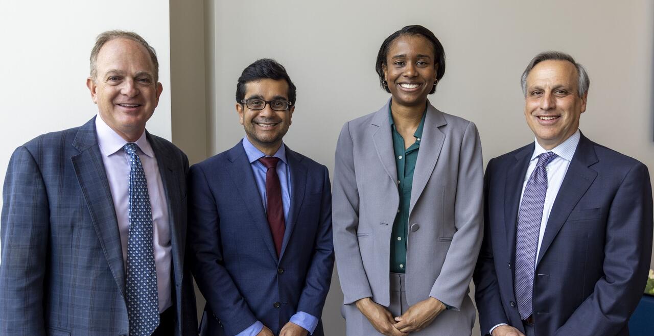 Dr. Robert Gerszten, Dr. Rishi Wadhera, Chantal Henry, and Dr. Peter Zimetbaum, all posed and smiling at a formal event